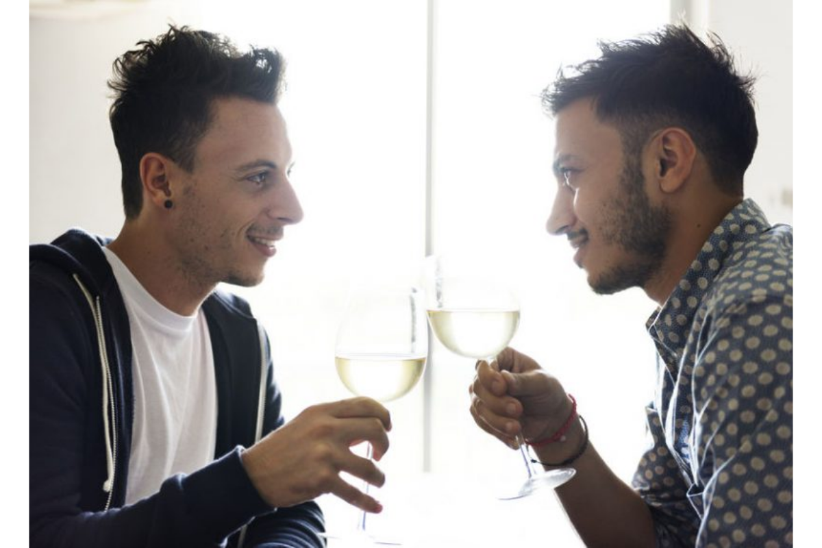 2 men clinking wine glasses 