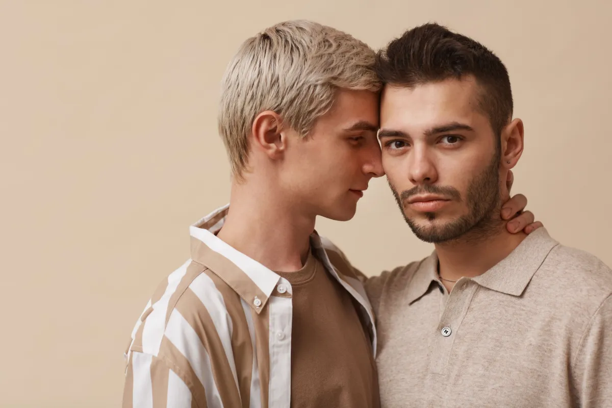 2 gay men with touching heads