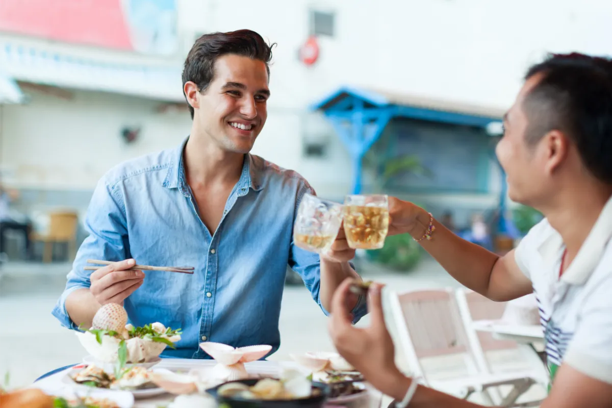 Two men eating and enjoying a date night