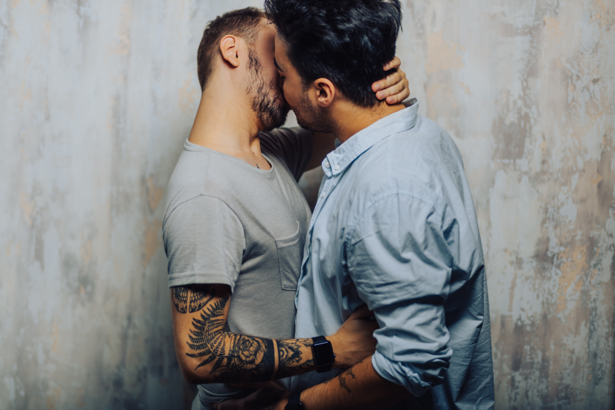 Two gay men kissing